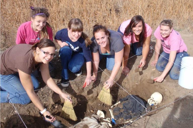 UNC Forensic Anthropology students excavate a mock skeleton at the Poudre Learning Center.